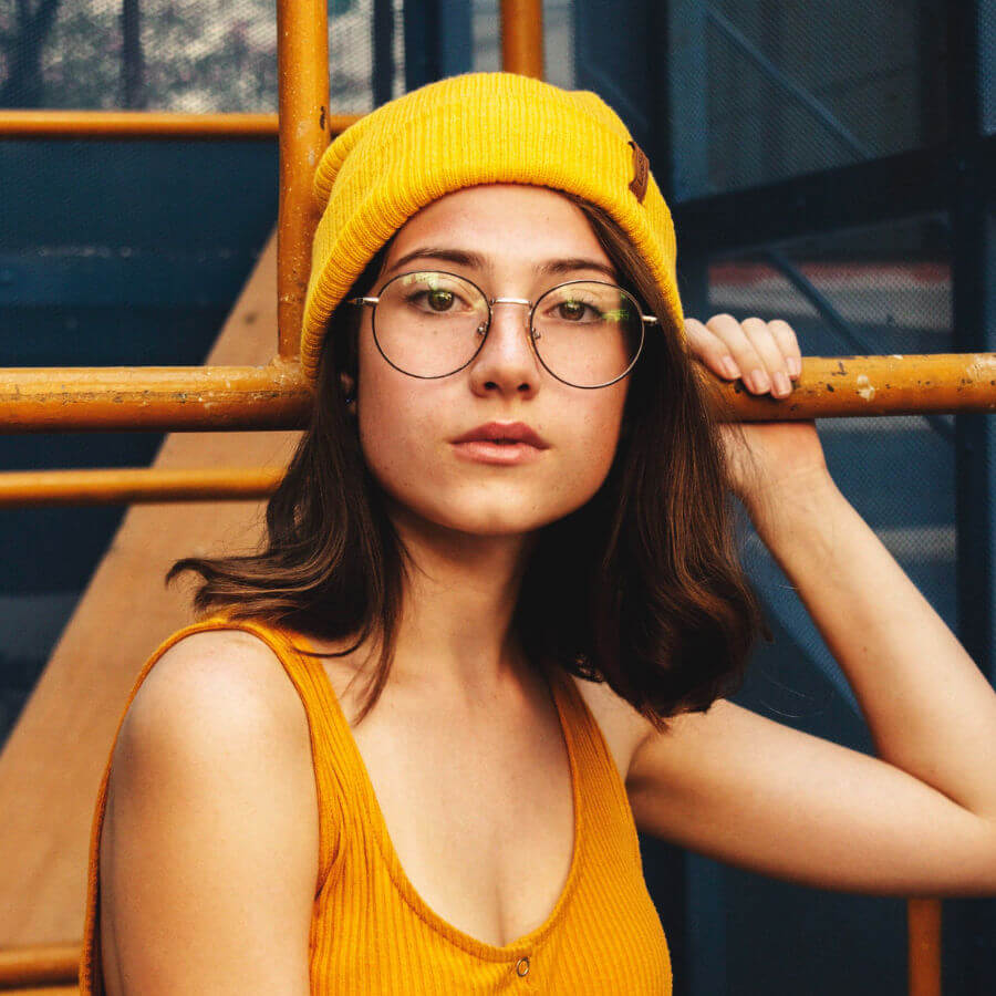 Young lady wearing glasses her mobile phone 